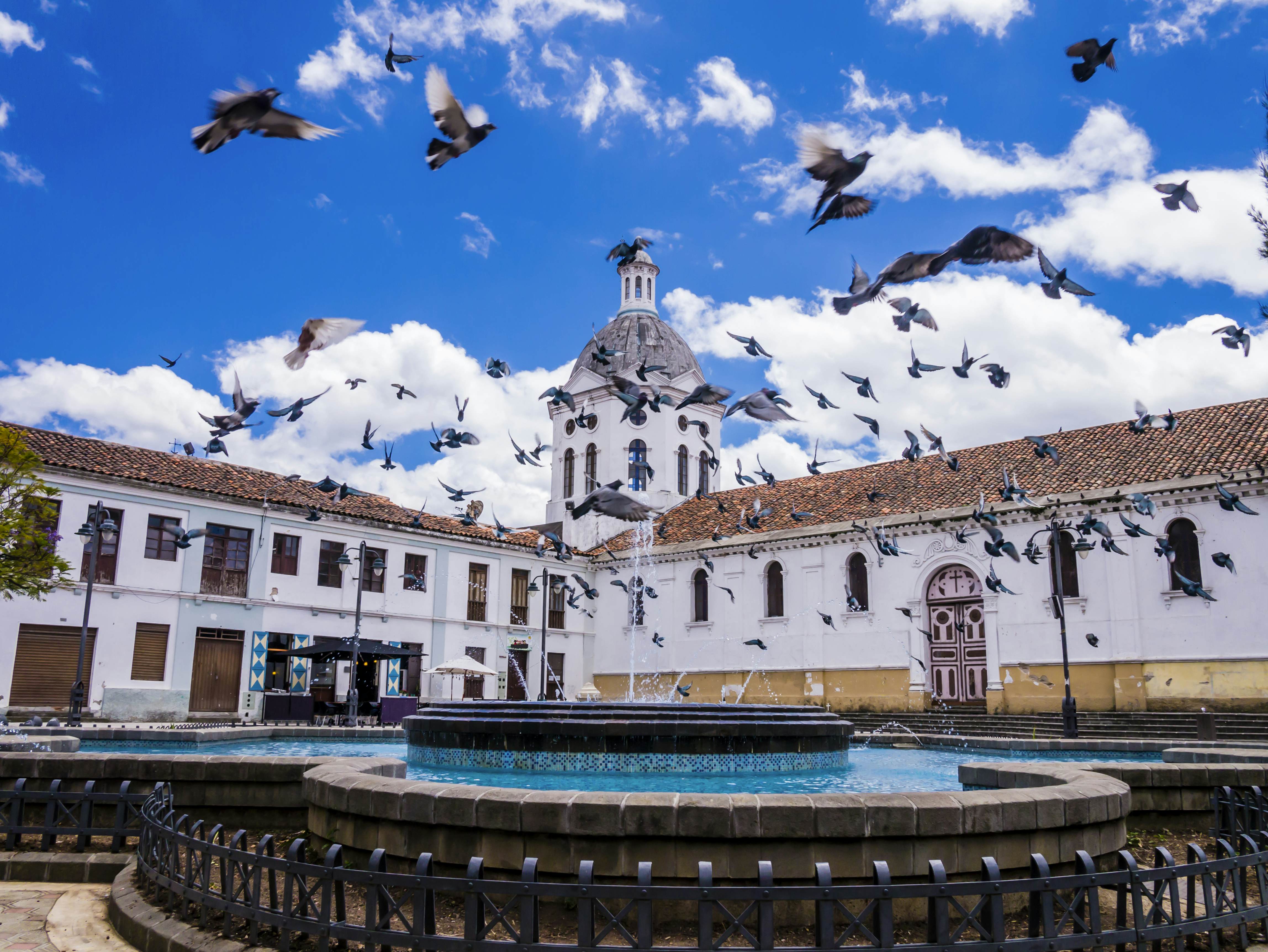 Ecuador, Cuenca city center, scenic view of San Sebastian church with fountain in foreground